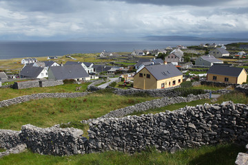 Caherard view and stone fence on inisheer island on aran islands