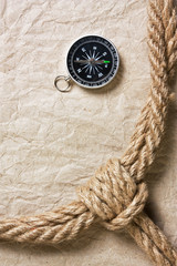 Fototapeta na wymiar compass, old paper and rope