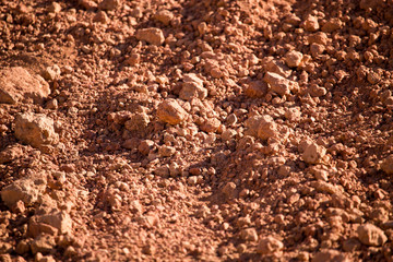 Red clay soil on nature as a background
