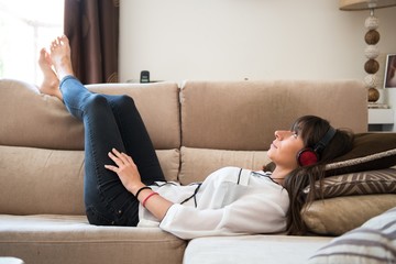 Beautiful young girl listening music