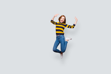 Fototapeta na wymiar Lifestyle leisure astonished shock unbelievable incredible careless holidays concept. Full-length full-size portrait of cute cheerful wondered pretty mad manager jumping up isolated gray background