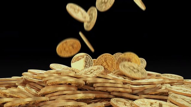 Gold bitcoins fall slow motion on pile. Falling golden coins on black background 4K slowmotion video with alpha channel. Cryptocurrency mining concept.