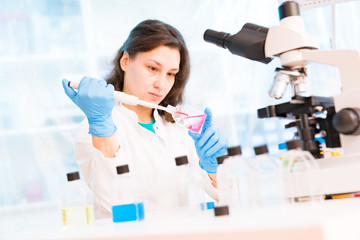 Fototapeta premium Young female technician in the laboratory of food quality control