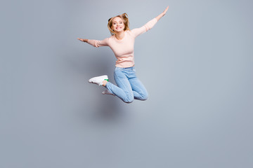Fototapeta premium Joy fun enjoy funny crazy mad funky chill positive lifestyle person concept. Full-size view of excited cheerful delight rejoicing pretty employee jumping up isolated on gray background