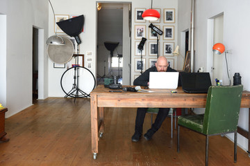 photographer working in his photography studio