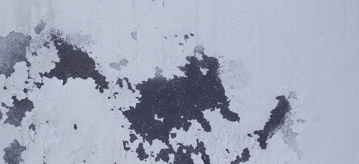 Old cracked rought dark and white plaster wall texture banner background