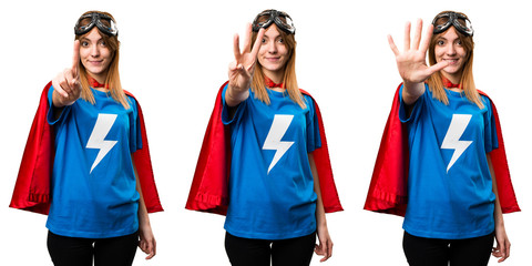 Pretty superhero girl counting three © luismolinero