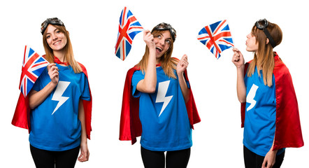 Pretty superhero girl holding an United Kingdom flag
