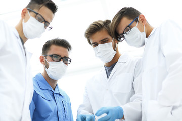 closeup. a team of doctors in protective masks.