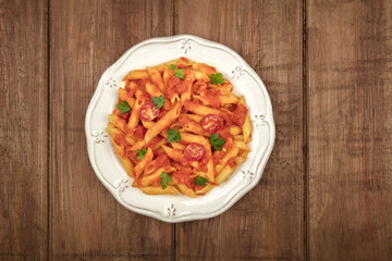 Penne pasta photo with tomato sauce and place for text