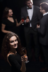 stylish young woman with glass of champagne