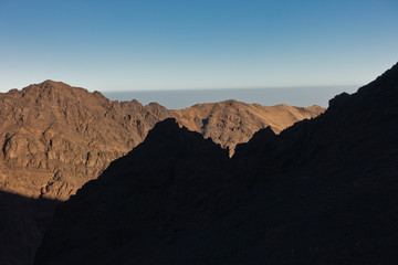 Fototapeta na wymiar Mountain peaks of High Atlas mountains at surise in Toubkal national park, Morocco, North Africa
