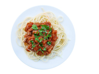 Neapolitan ragu with spaghetti pasta on plate over wooden table, top view.
