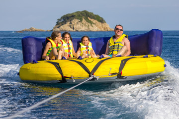 Family water sport adventure on the sea