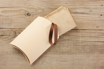 Christmas gift box on the old wooden background