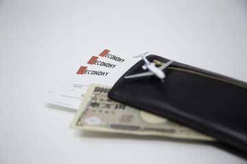 plane ticket and Japanese money