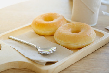 Close up Delicious donuts on wooden plate