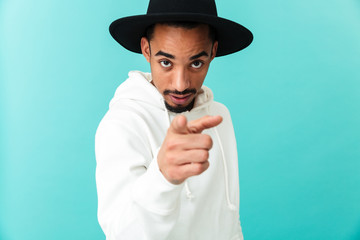 Portrait of a confident young afro american man in hat
