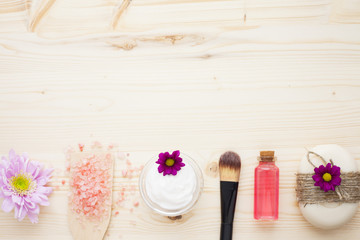 Spa and natural cosmetic concept. Composition of spa treatment for beauty and skincare on the wooden background. Top view. Close up.
