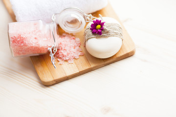 Spa and natural cosmetic concept. Composition of spa treatment for beauty and skincare on the wooden background. Top view. Close up.