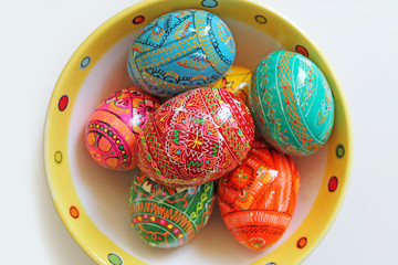 Hand painted Easter eggs on a plate. Traditional Czech easter eggs.