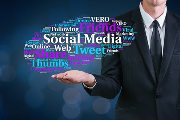 Social media words cloud presented by a man