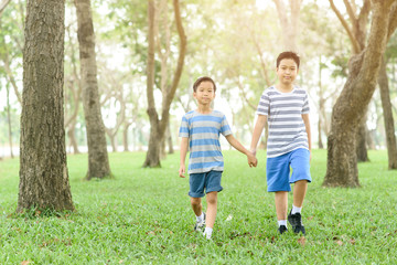 Fototapeta premium Two boy hold their hand and walk