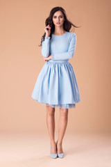 Naklejka premium Beautiful fashionable woman in nice dress, handbag and accessories. Fashion spring summer photo