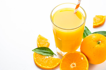 Orange juice in glass on white.