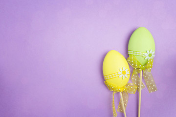 Decorative Easter eggs with on purple background. Space for text.