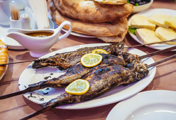 grilled fishes and Georgian bread - traditional food in Georgia