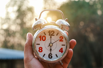 An Alarm Clock Set To 5 to 6 AM to Wake up early