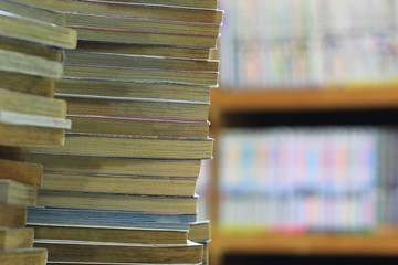Stacking of old books on bookshelf in the library room
