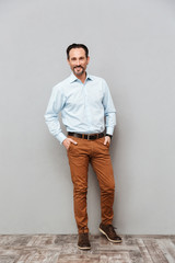 Fototapeta premium Full length portrait of a smiling mature man