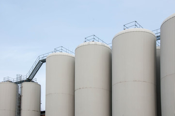 Production. Industrial buildings in the blue sky
