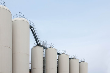 Production. Industrial buildings in the blue sky
