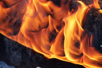 Fire in the fireplace close-up. Flame of fire. Hellfire.