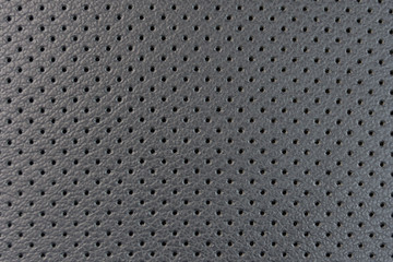 leather texture with small black holes, abstract background