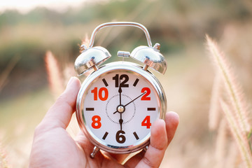 An Alarm Clock Set To 5 to 6 AM to Wake up early