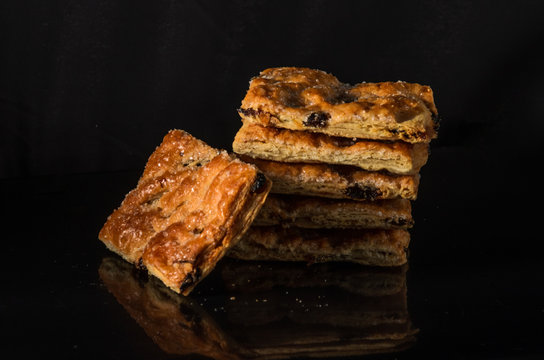 Biscuits with raisins and sugar isolated with on a black background