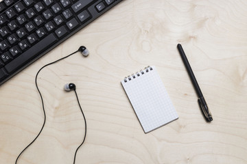 Office table with copybook, computer. View from above