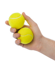 Hand with tennis balls