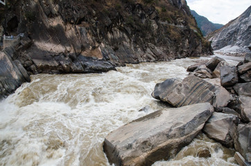 The torrential flow through the hills in Tibet