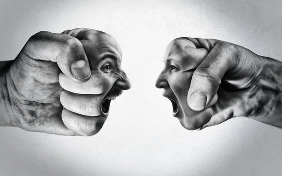 Two fists with a male and female face collide with each other on light background. Concept of confrontation, competition, family quarrel etc. Black and white.