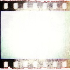 Naklejka premium Vintage squared film strip frame in sepia tones.