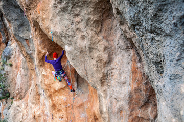 A rock climber on a rock.