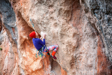 A rock climber on a rock.