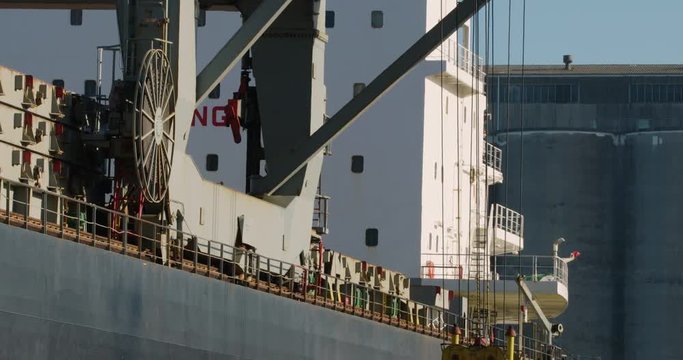 Aluminum ingots being loaded onto a ship for export from Australia - 4K 30P. 