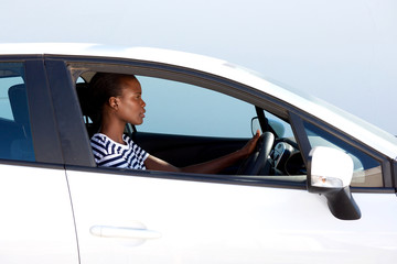 Naklejka premium young african woman driving car