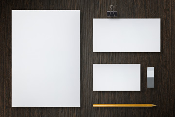 Blank letterhead, business cards, envelope and pencil. Top view.